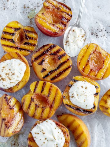 Overhead shot of grilled peaches topped with ricotta