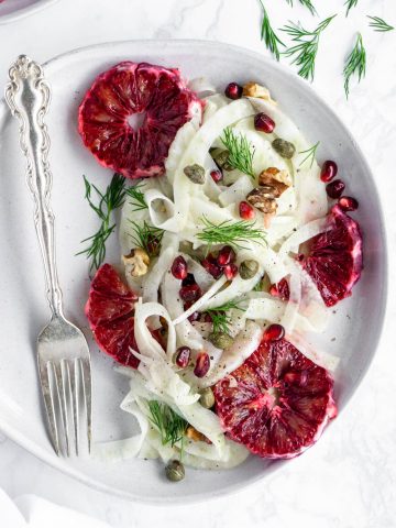 Overhead shot of a fennel salad with blood oranges in a plate