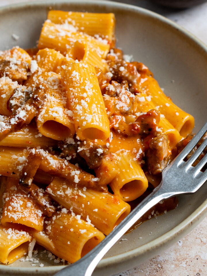Pasta alla zozzona in a plate with a fork