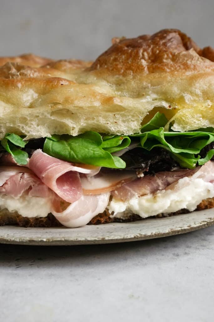 Pancetta Sandwich with Pecorino Cream, Sundried Tomatoes and Arugula Pina Bresciani