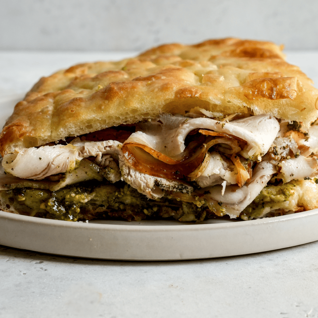 Porchetta Sandwich with and Pistachio Pesto Pina Bresciani