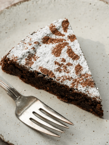 Slice of almond flour chocolate cake on a plate