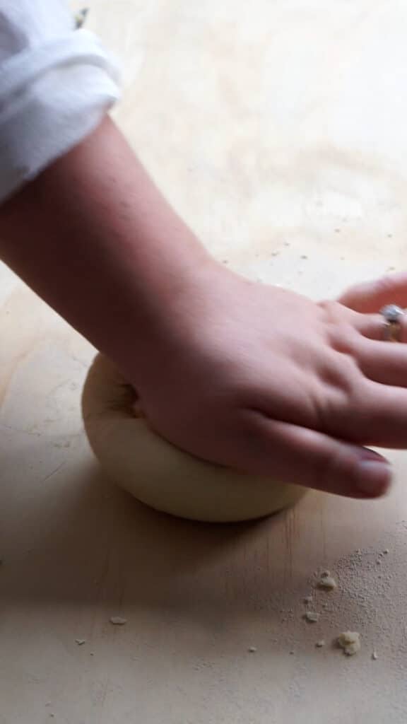Kneading dough ball with hands