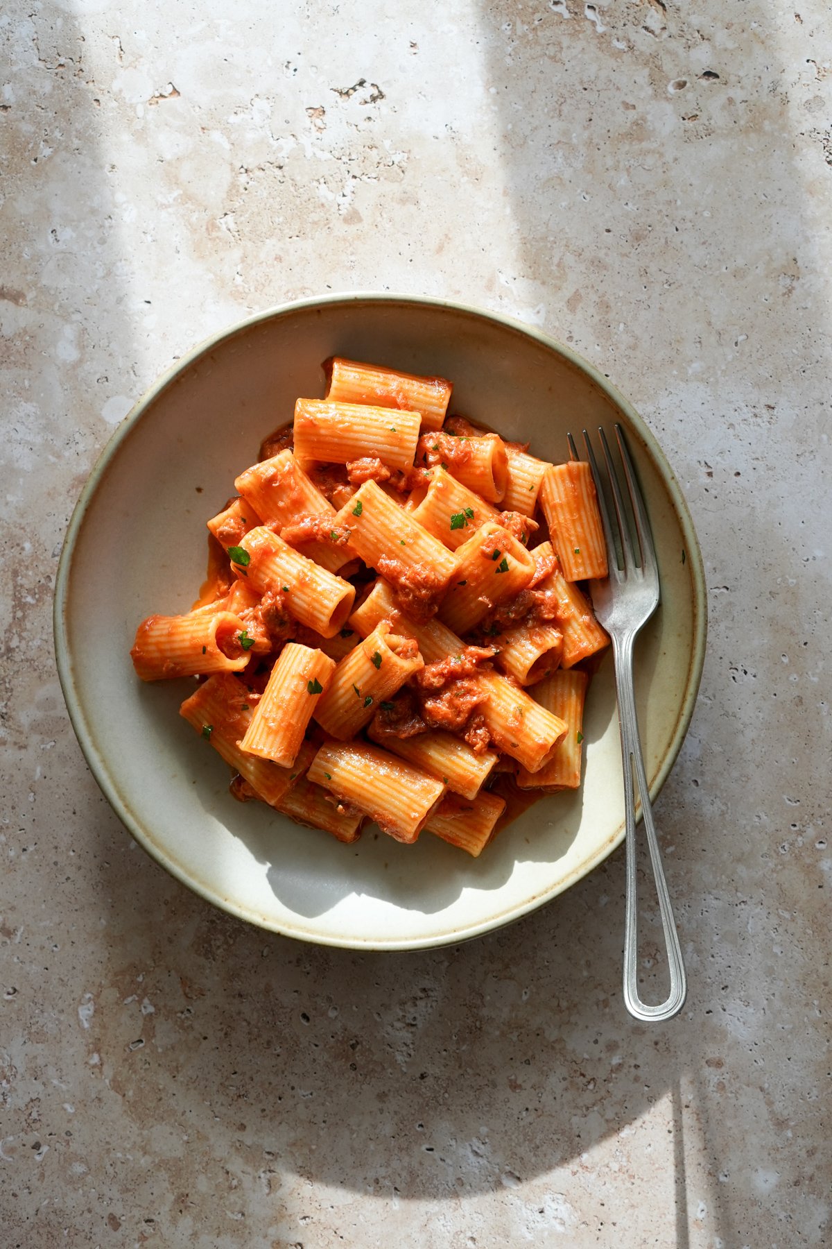 Canned tuna pasta in a dish with a fork to the side