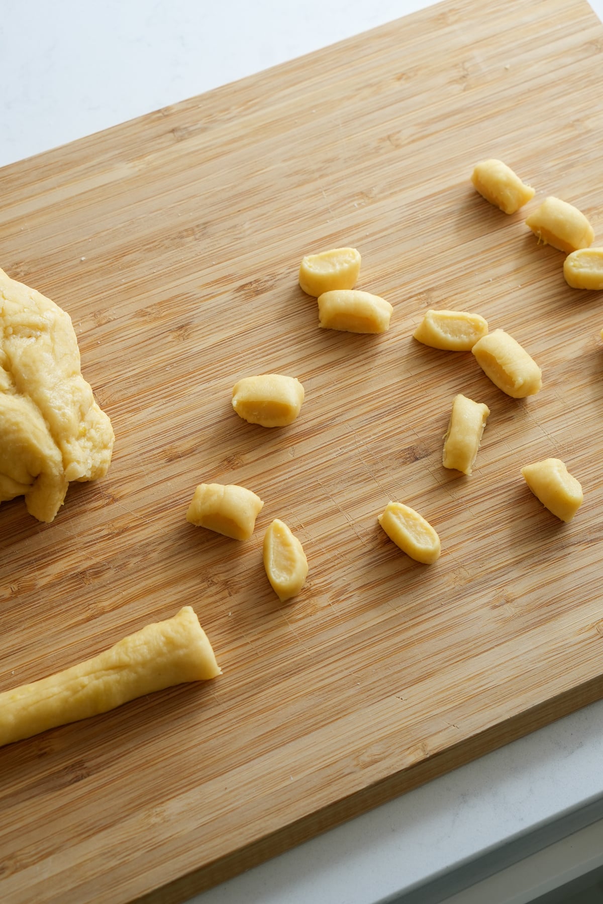 Struffoli balls cut from a piece of dough