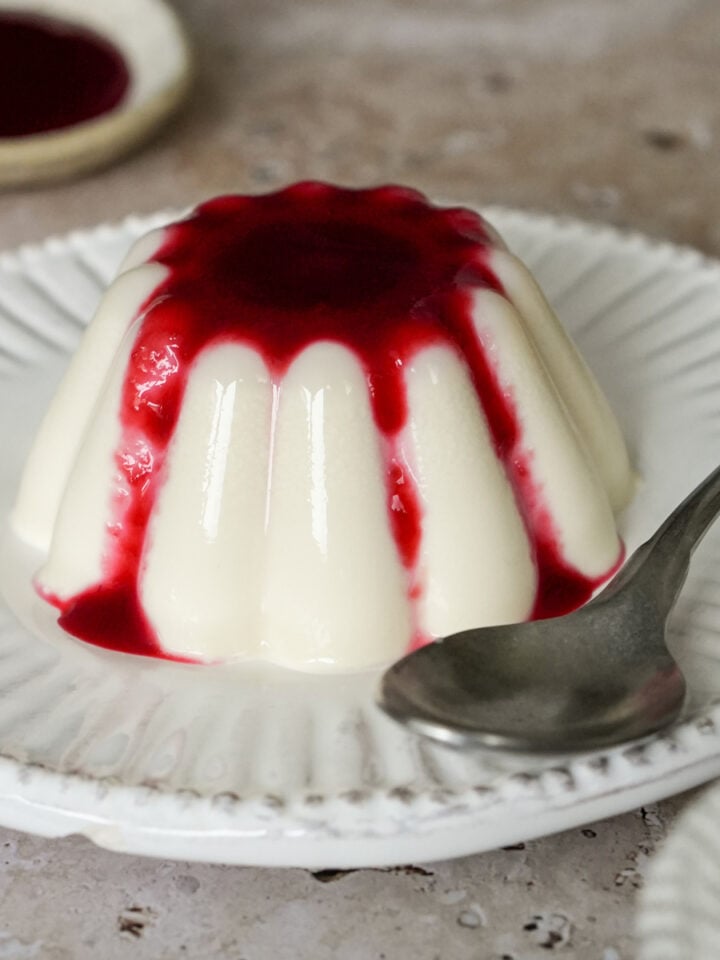 Italian panna cotta in a white dessert dish