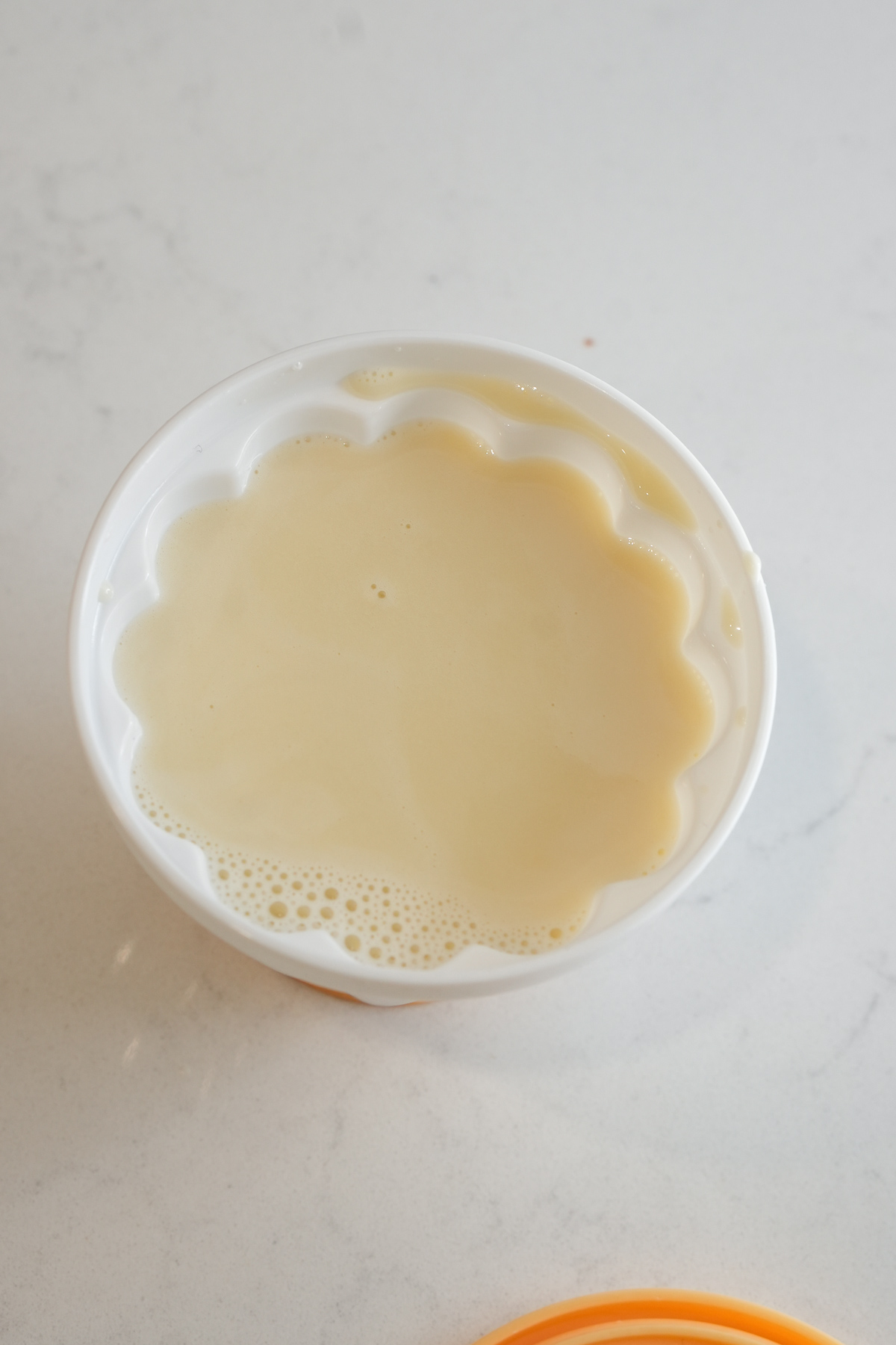 Panna cotta liquid in a mold, before setting