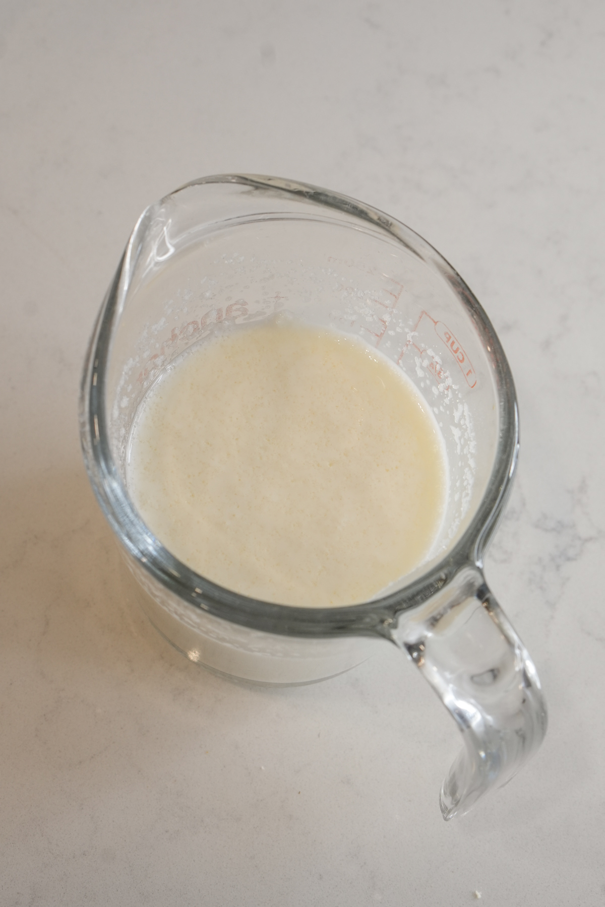 Milk and gelatin in a measuring cup