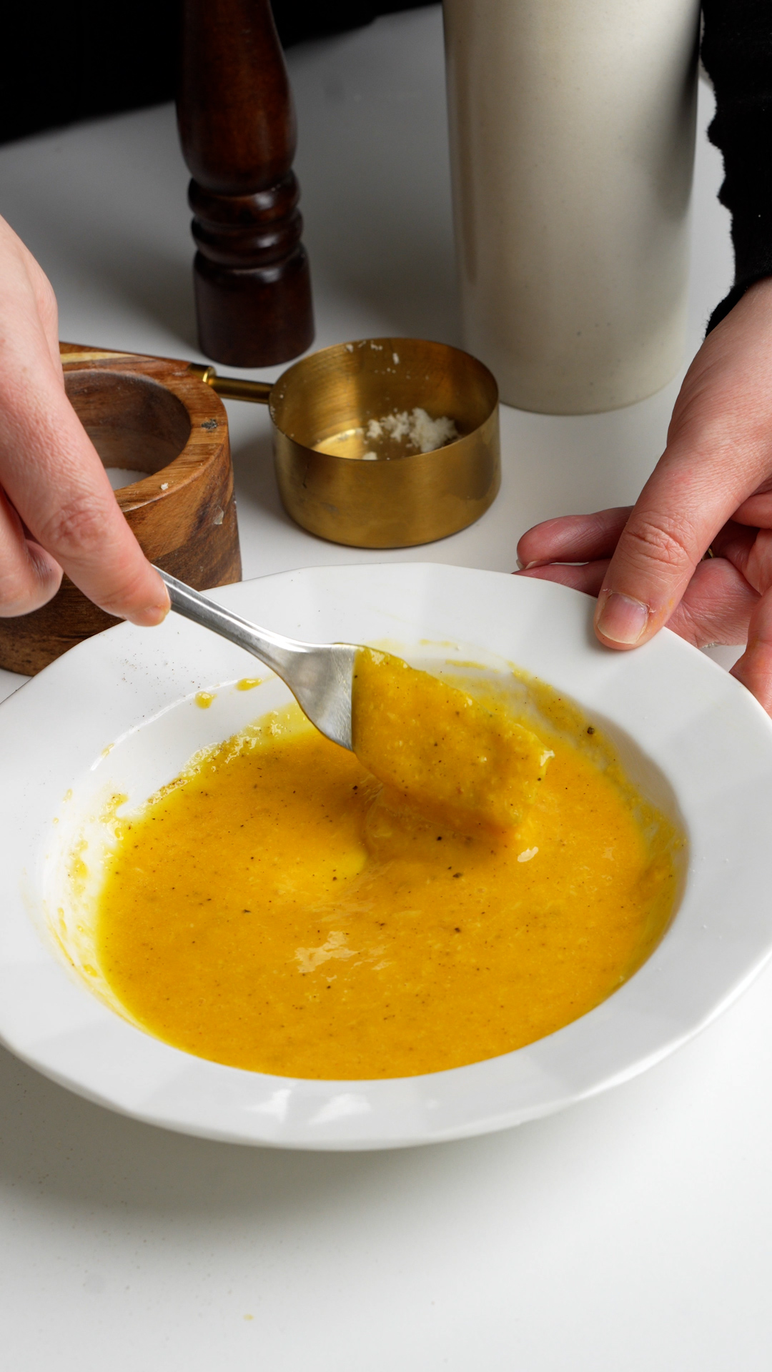 Beaten egg yolks, grated pecorino, and black pepper in a dish