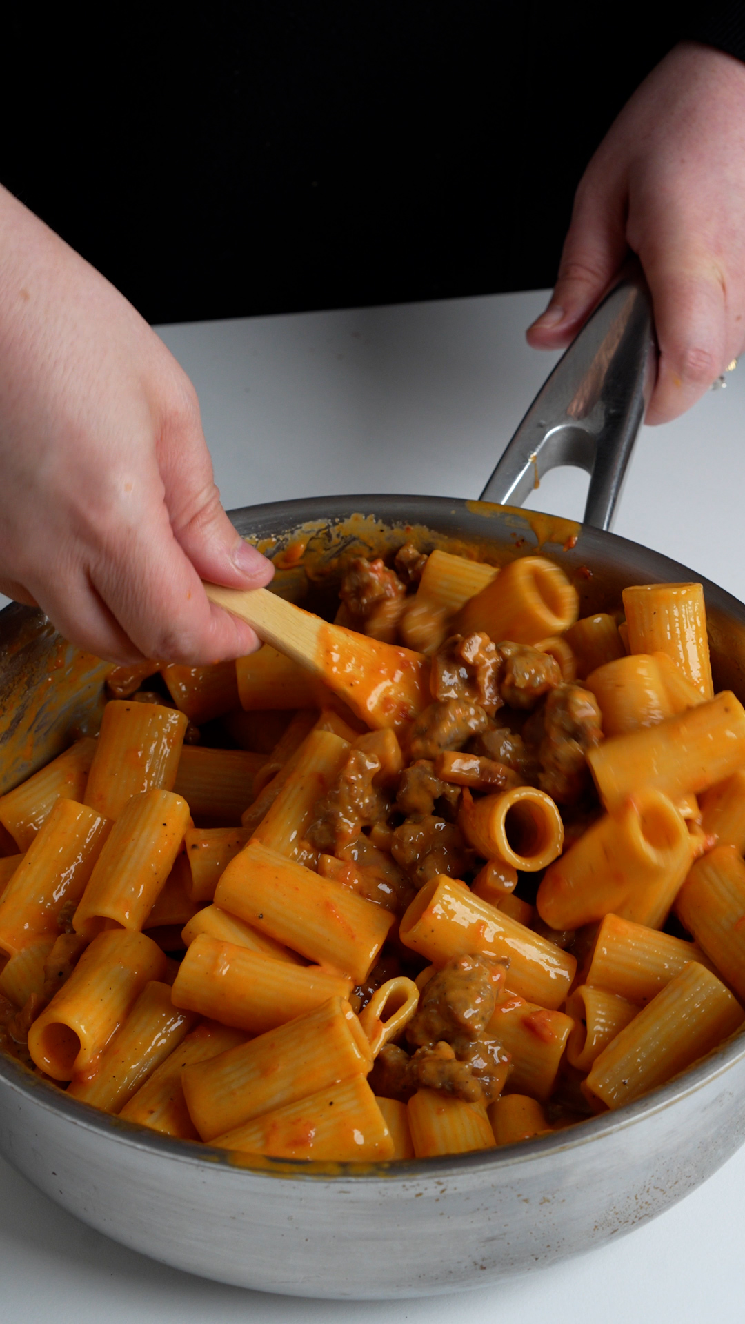 Pasta alla zozzona being mixed in a pan