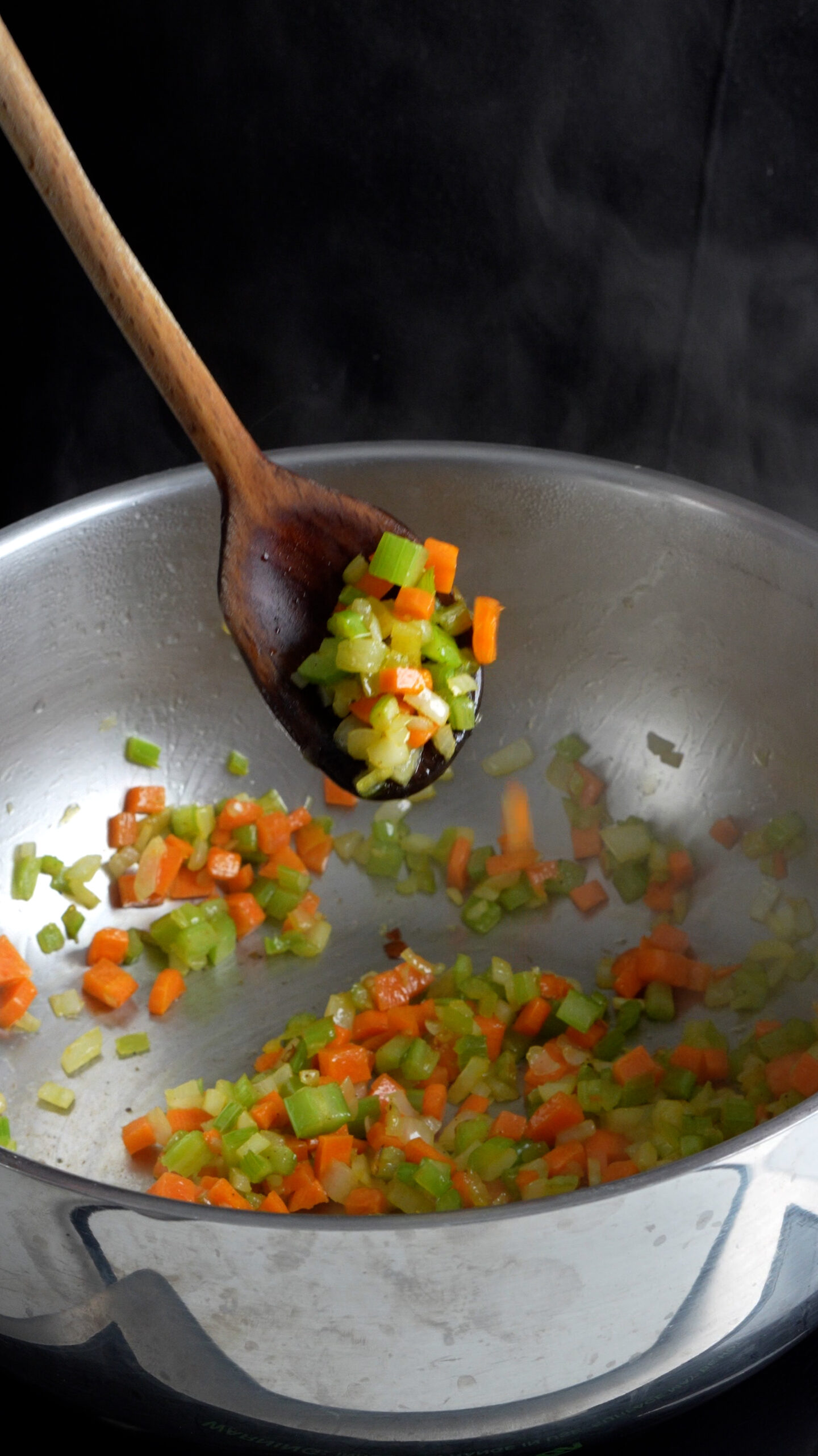 Soffritto of carrot, celery and onion in a pot