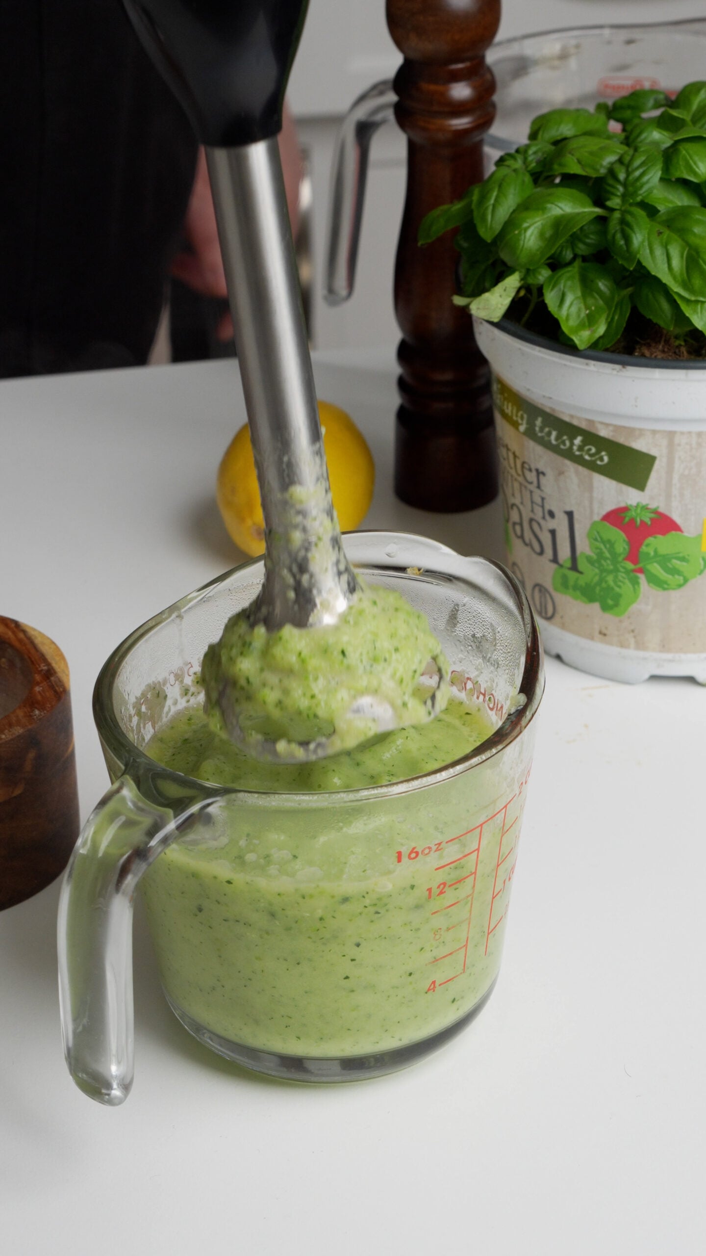 Zucchini being blended with an immersion blender