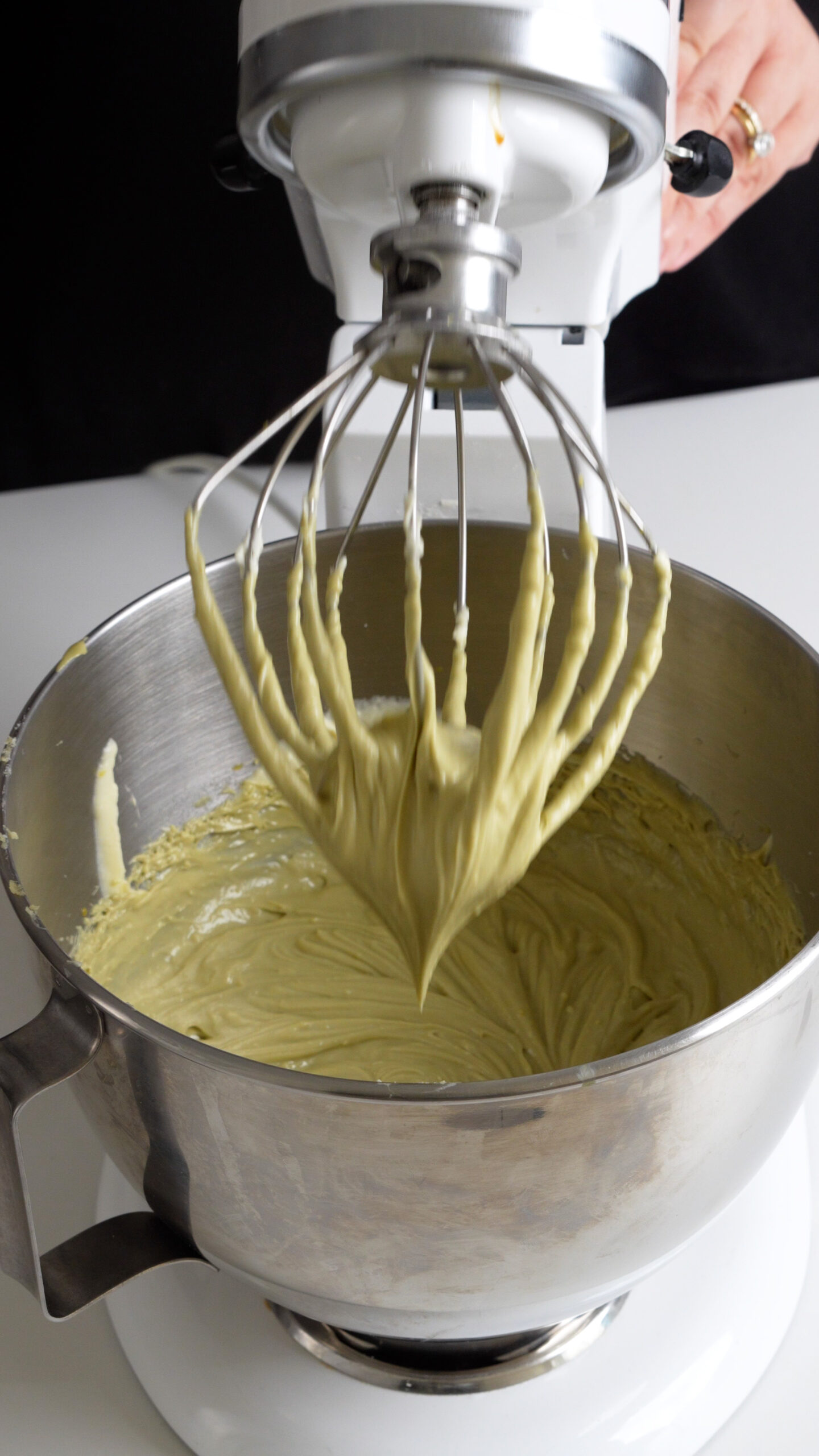 Tiramisu pistachio mascarpone cream in the bowl of a stand mixer