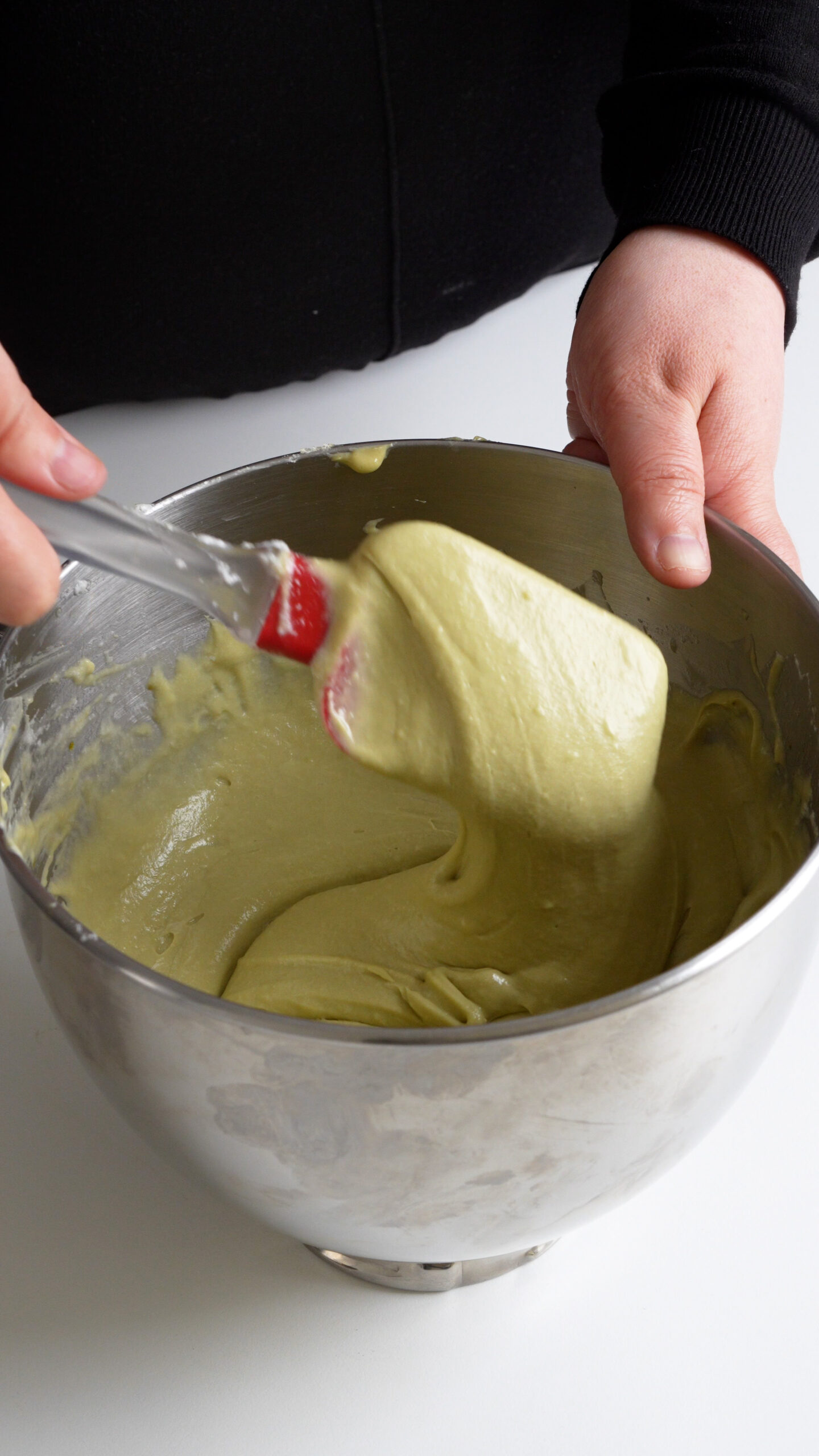 Pistachio tiramisu cream on a spatula
