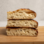 Three pieces of focaccia stacked on top of each other