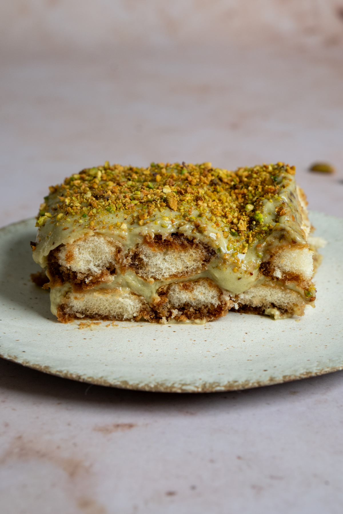 Piece of pistachio tiramisu on a plate