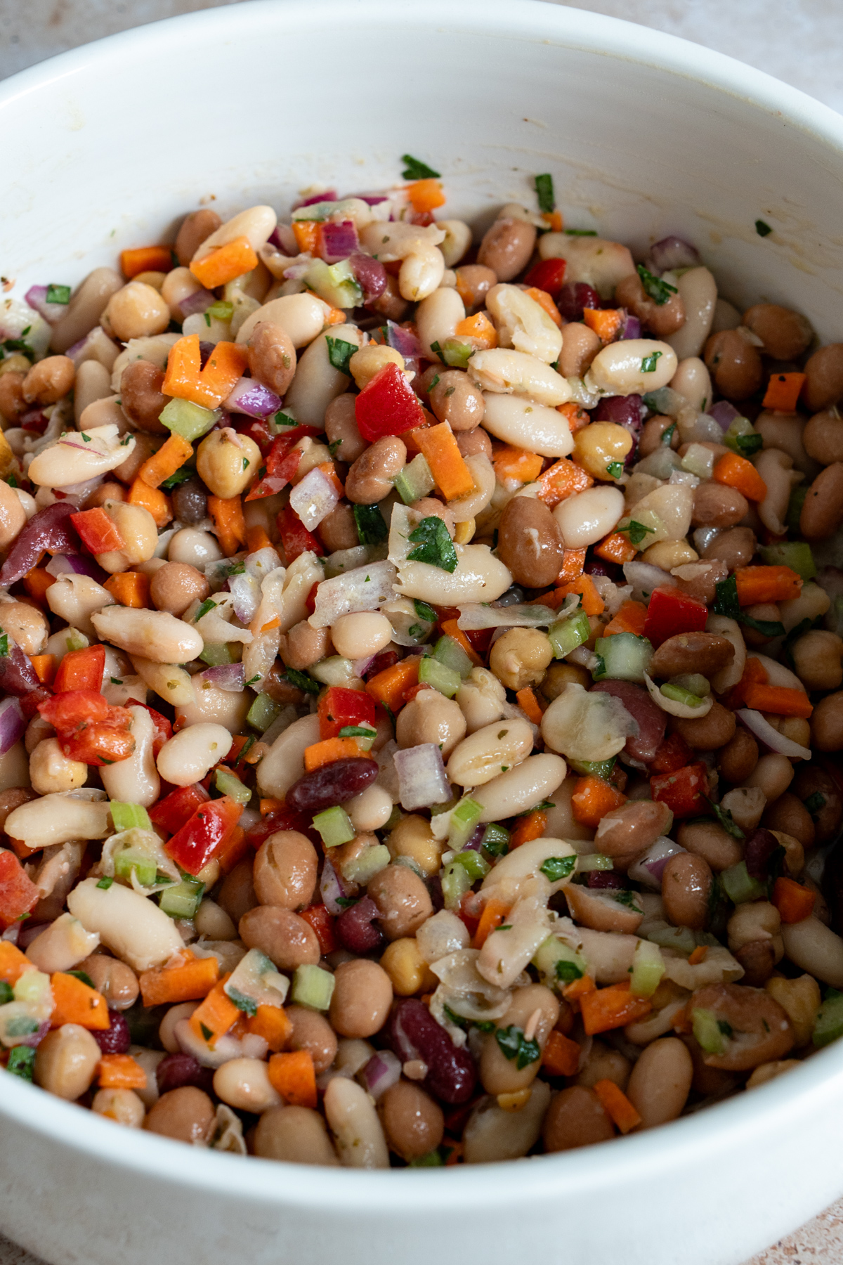 Bean salad in a big white bowl