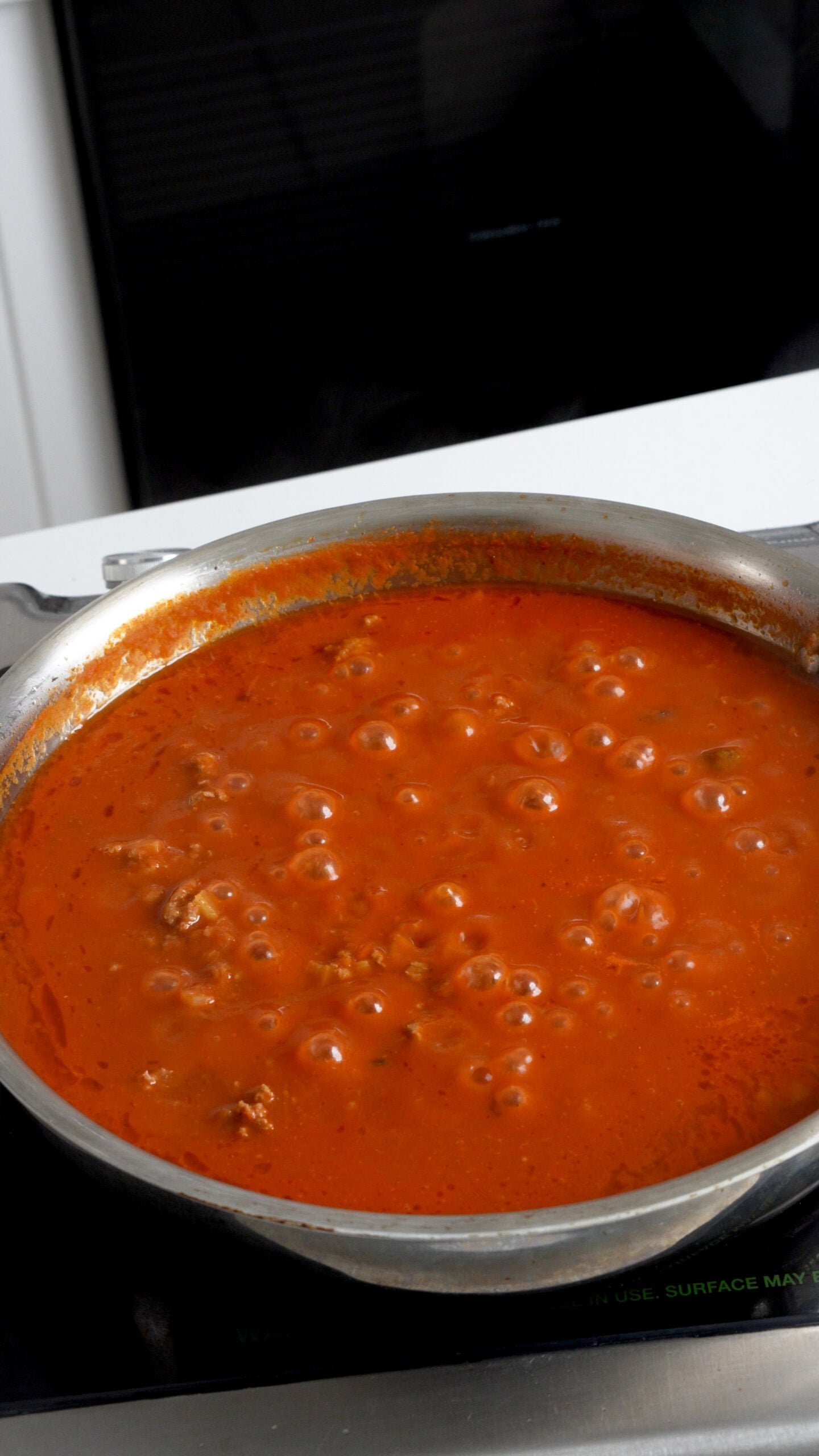 Meat sauce simmering in a pan