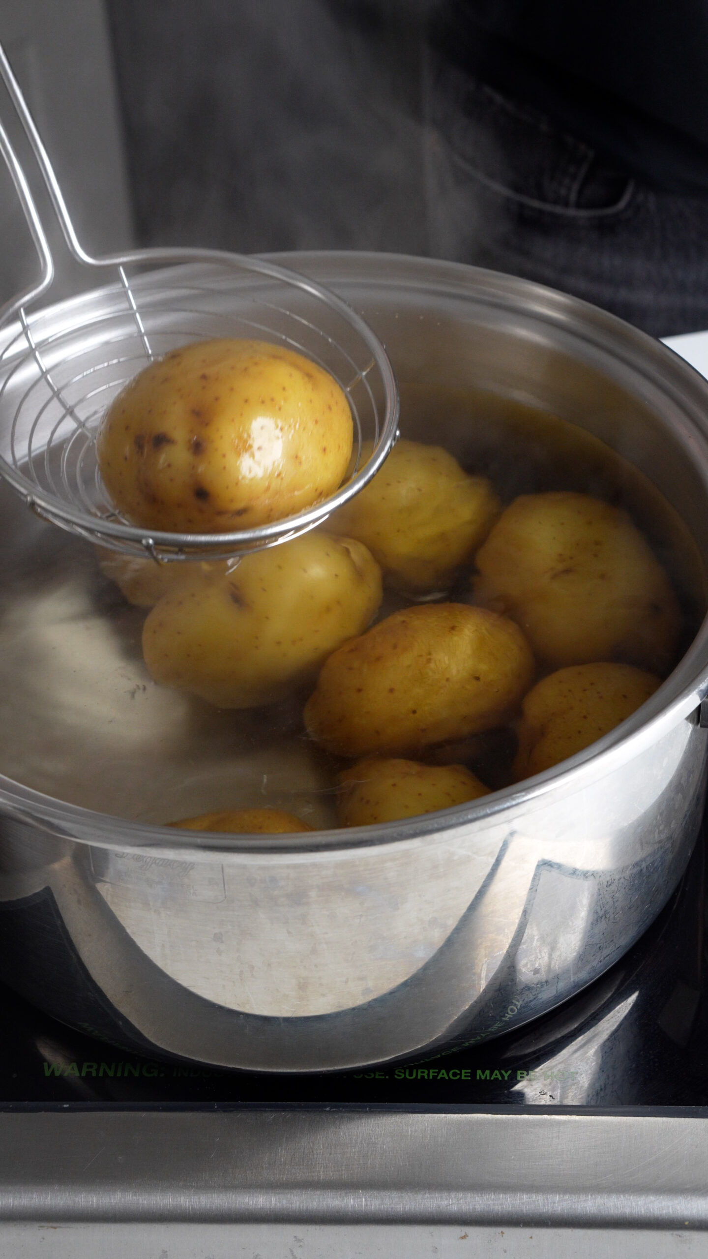 Potatoes being boiled in a pot