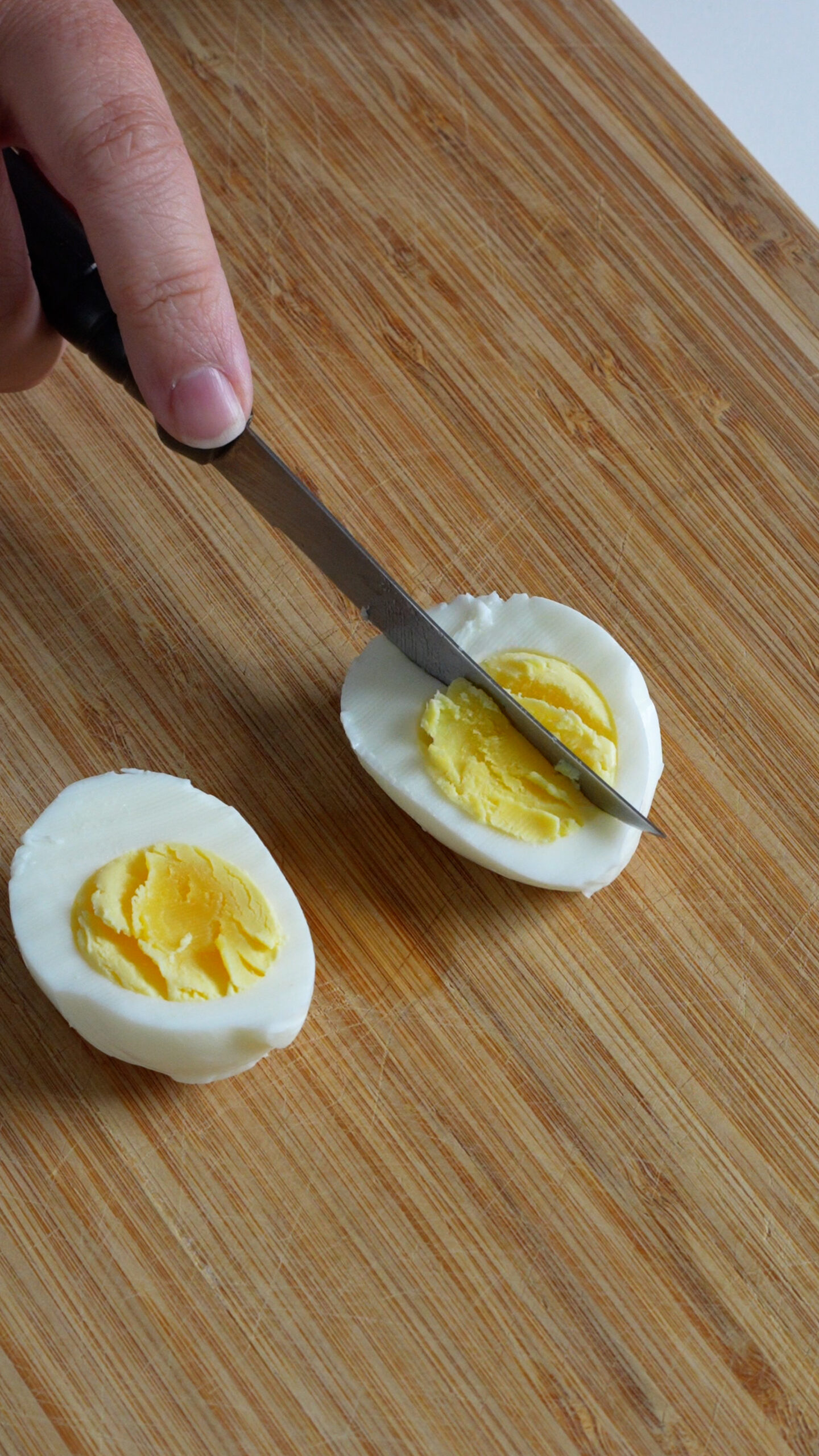 Hard boiled eggs being cut